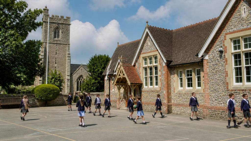 Children arriving at a Church of England primary school in Kent with parents at the gate - Faith schools in Kent: how admissions really work