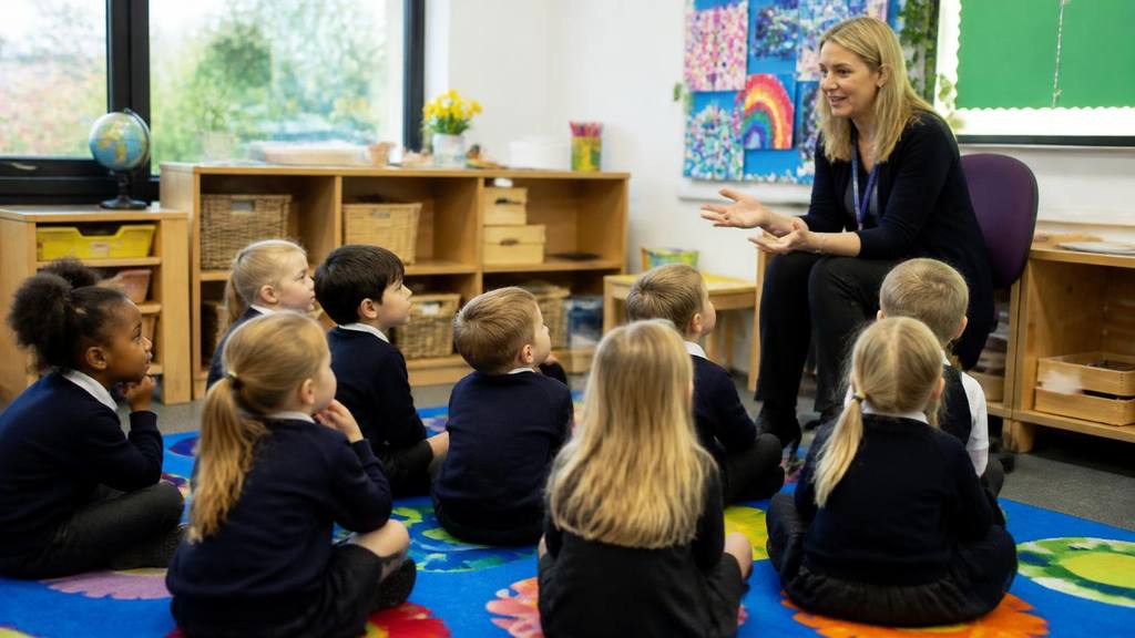 A parent and reception-age child at the entrance of a Kent primary school - Primary school admissions in Kent: reception applications explained